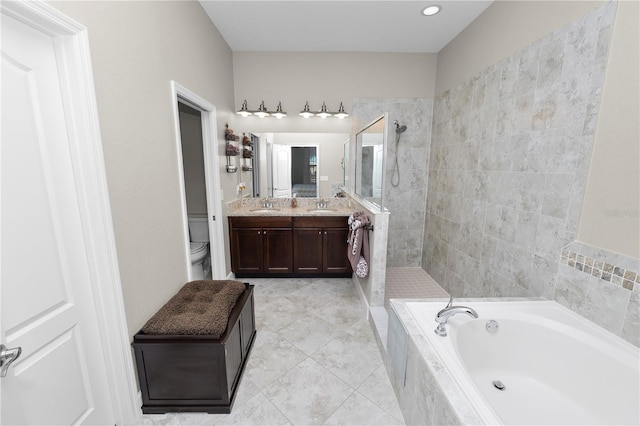 full bathroom with plus walk in shower, tile patterned floors, vanity, and toilet