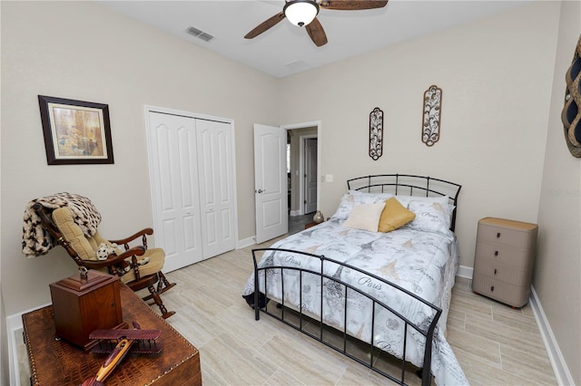 bedroom with ceiling fan and a closet