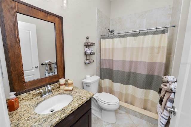 bathroom featuring toilet, a shower with curtain, vanity, and tile patterned floors