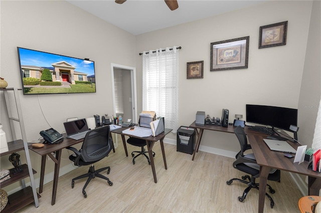 home office featuring ceiling fan and light hardwood / wood-style flooring