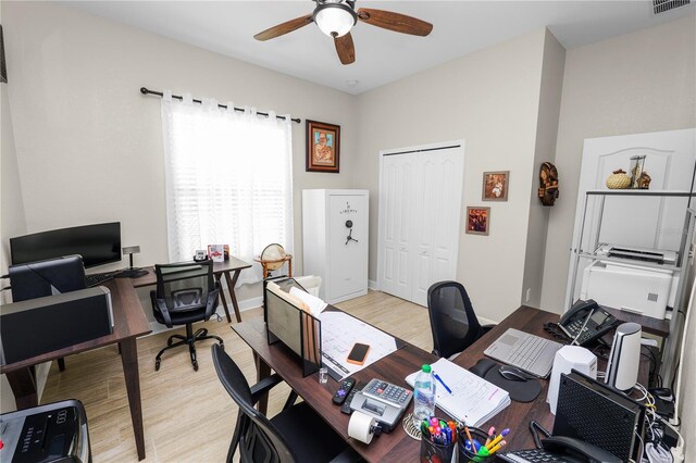 office space featuring ceiling fan and light wood-type flooring