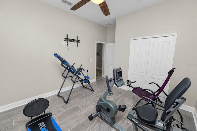 workout area with light wood-type flooring and ceiling fan