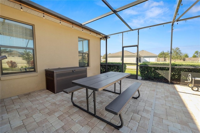 view of patio with a lanai