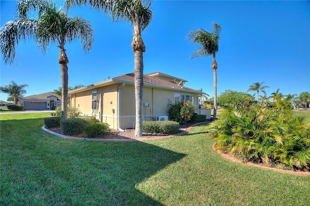 view of home's exterior with a yard