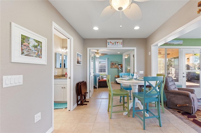 dining space featuring ceiling fan, light tile patterned flooring, and french doors