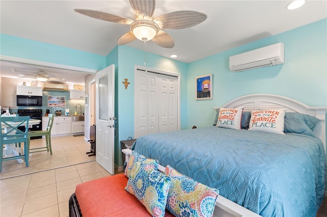 tiled bedroom with a wall mounted air conditioner, sink, a closet, and ceiling fan