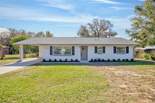 ranch-style house with a carport and a front lawn