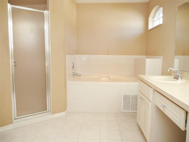 bathroom featuring tile patterned flooring, vanity, and independent shower and bath