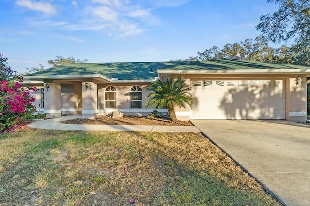 ranch-style home with a garage