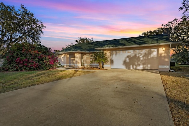 ranch-style house featuring a garage