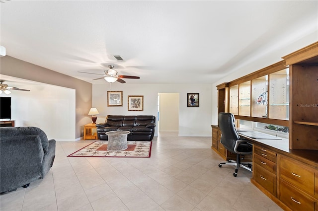 tiled office featuring ceiling fan