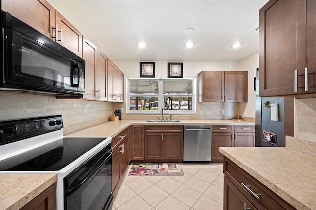 kitchen featuring sink, stainless steel dishwasher, range with electric stovetop, a textured ceiling, and light tile patterned flooring