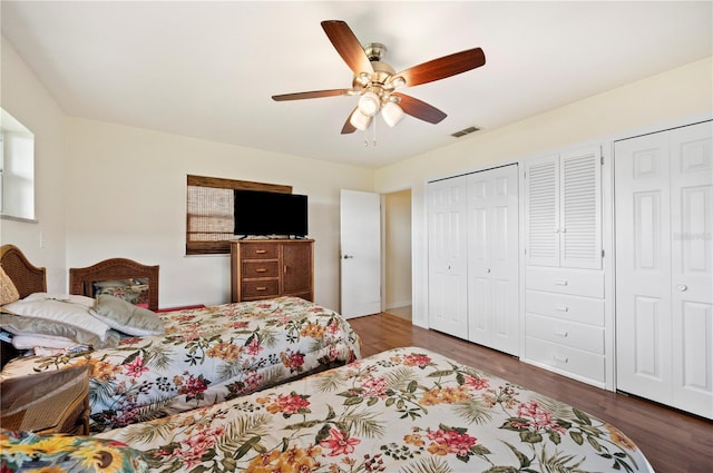 bedroom with ceiling fan and dark hardwood / wood-style floors