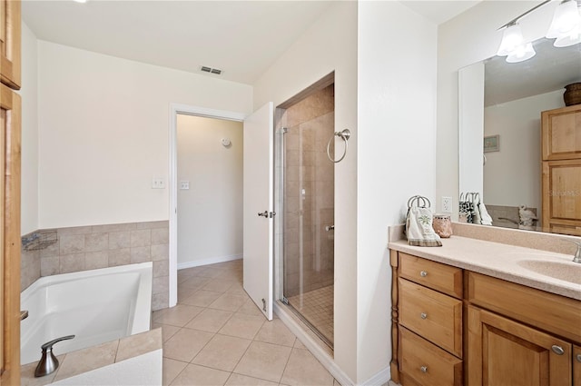 bathroom with separate shower and tub, tile patterned flooring, and vanity