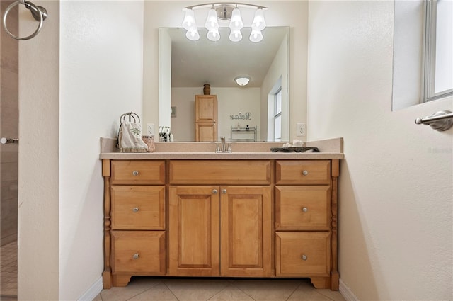 bathroom with tile patterned flooring and vanity