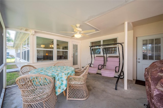 sunroom / solarium with ceiling fan