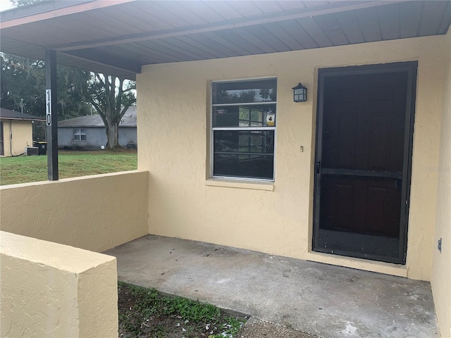 entrance to property featuring central AC