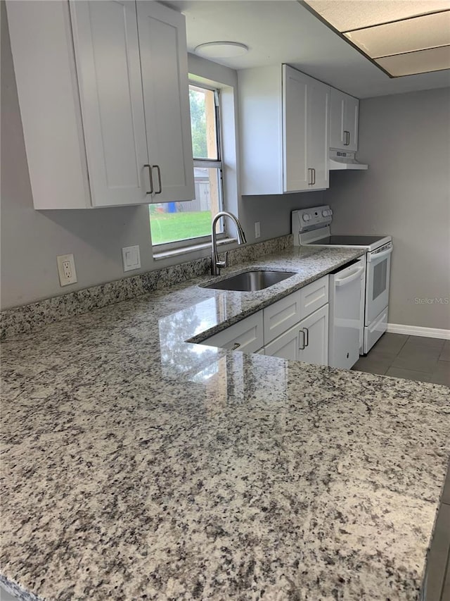 kitchen featuring sink, white cabinets, and white appliances