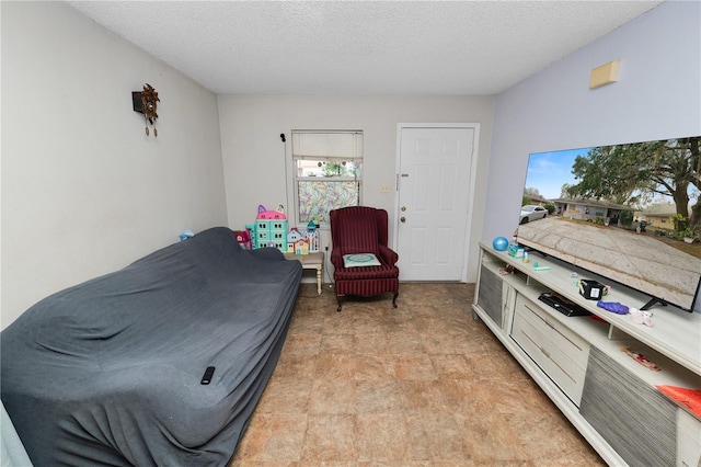 bedroom featuring a textured ceiling