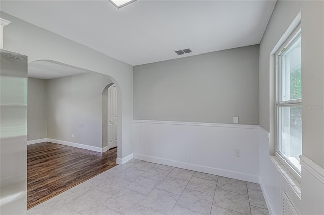 spare room featuring light hardwood / wood-style flooring