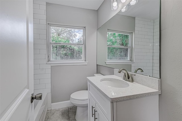 full bathroom featuring tile patterned flooring, vanity, a healthy amount of sunlight, and toilet