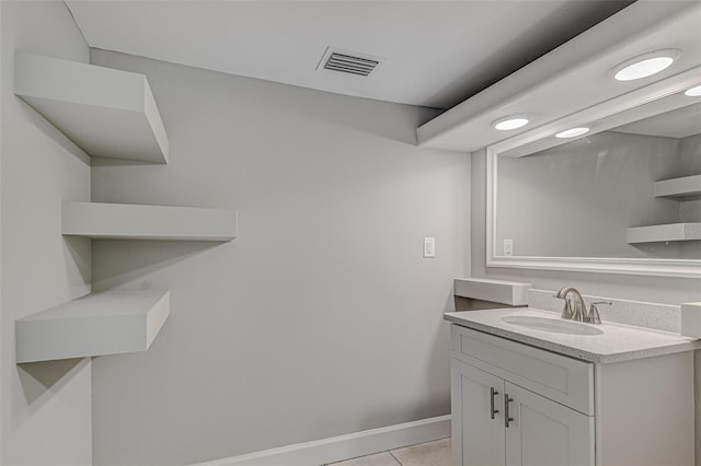 bathroom featuring tile patterned flooring and vanity