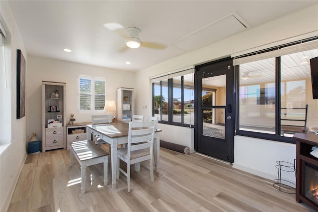 dining area featuring ceiling fan and light wood-type flooring