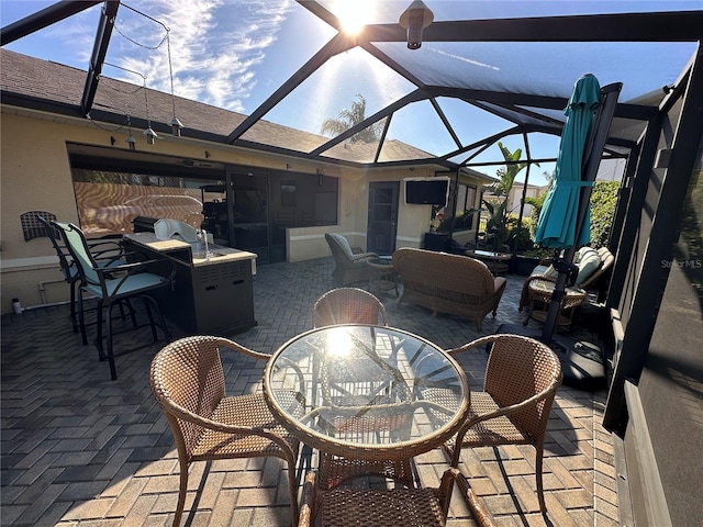view of patio with a lanai and an outdoor bar