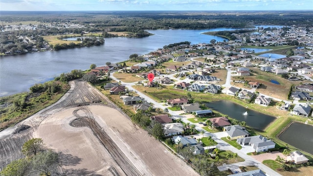 drone / aerial view with a water view