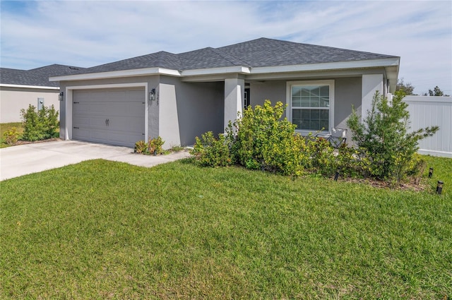 view of front facade featuring a garage and a front lawn