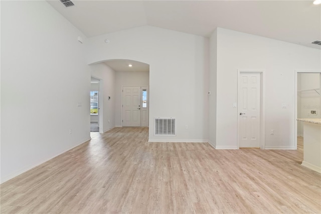 unfurnished room with light hardwood / wood-style flooring and high vaulted ceiling