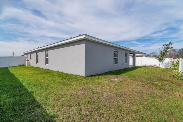 view of property exterior with a yard