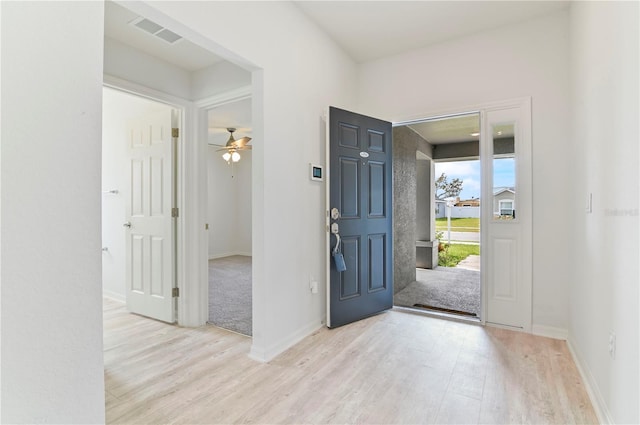 foyer featuring ceiling fan and light wood-type flooring