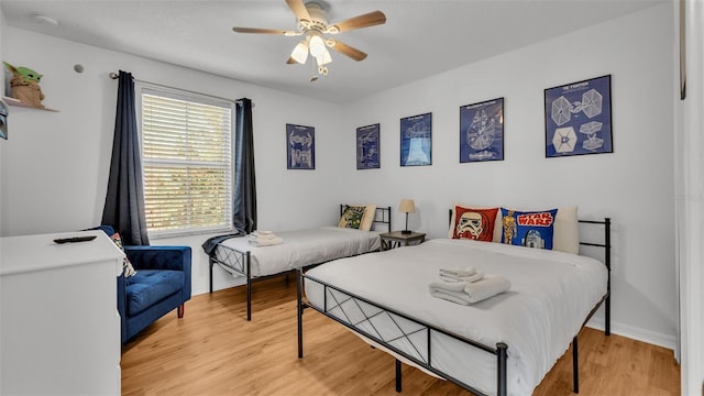 bedroom featuring ceiling fan and hardwood / wood-style floors