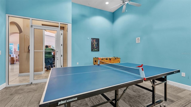 game room with recessed lighting, baseboards, arched walkways, and ceiling fan