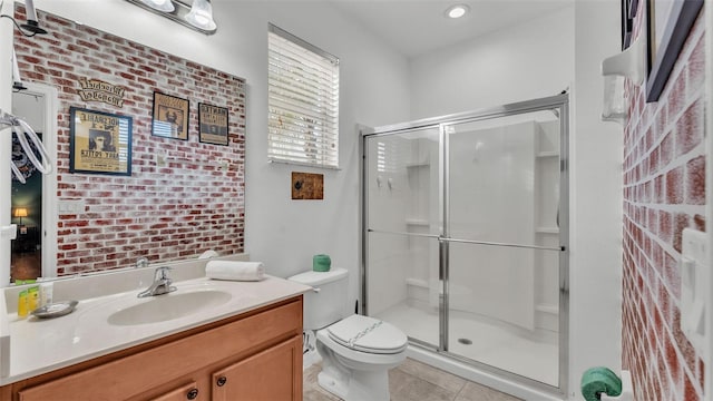 bathroom with tile patterned floors, a shower with door, and brick wall