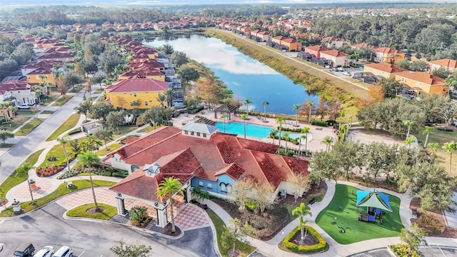 birds eye view of property with a water view and a residential view