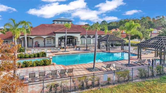 pool featuring a gazebo, a patio area, and fence