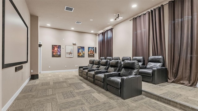 cinema room with light carpet, visible vents, recessed lighting, and baseboards