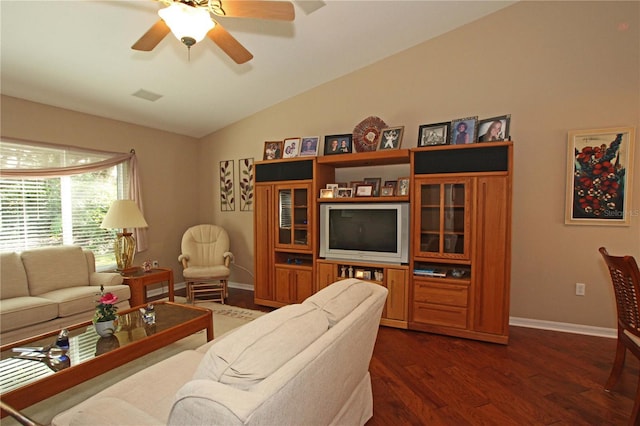 living room featuring vaulted ceiling, ceiling fan, and dark hardwood / wood-style floors