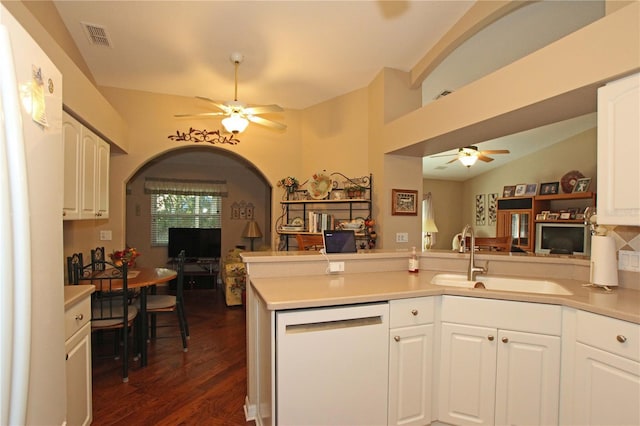 kitchen with white cabinetry, sink, dark hardwood / wood-style flooring, kitchen peninsula, and white dishwasher