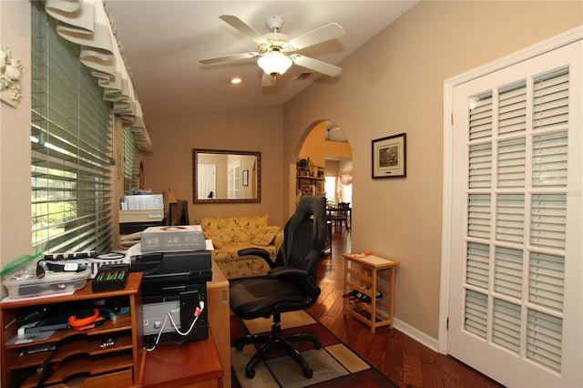 office space featuring ceiling fan, hardwood / wood-style floors, and vaulted ceiling