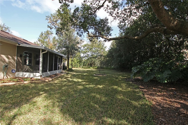 view of yard featuring a sunroom