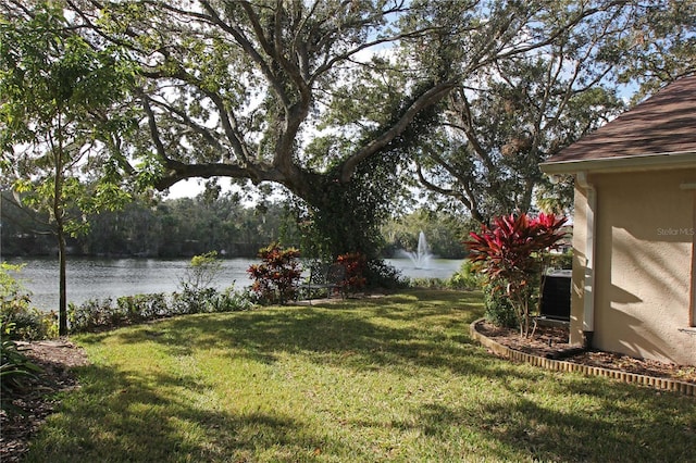 view of yard with a water view