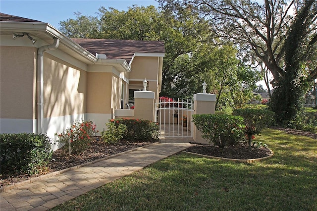 view of home's exterior featuring a yard