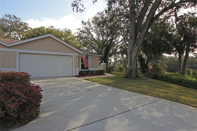 view of front of house featuring a front yard and a garage