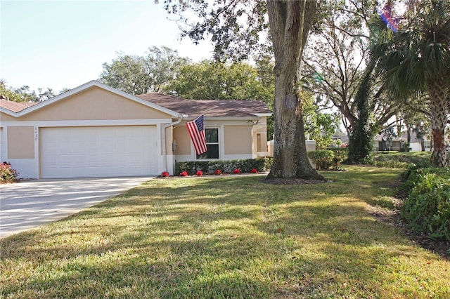 single story home with a front yard and a garage