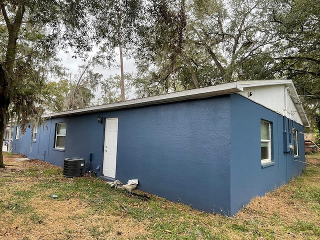 view of side of property featuring cooling unit