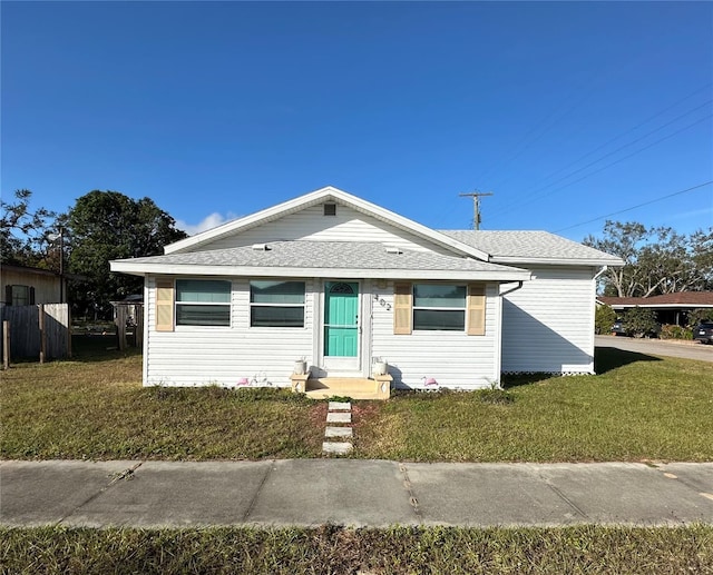 bungalow-style house with a front yard