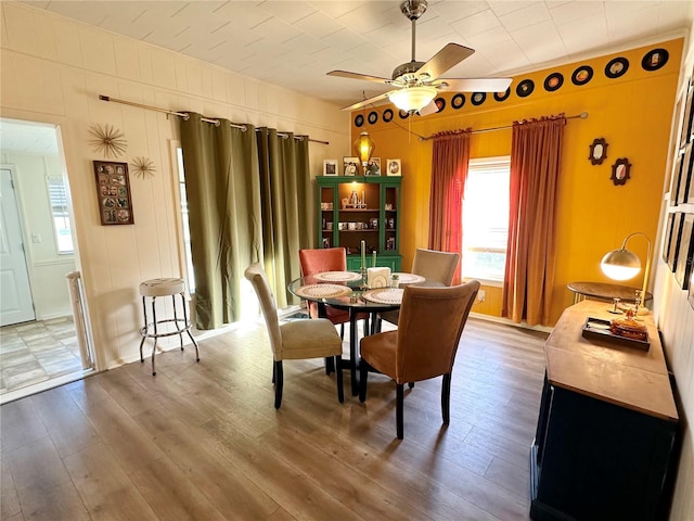 dining room featuring hardwood / wood-style floors and ceiling fan